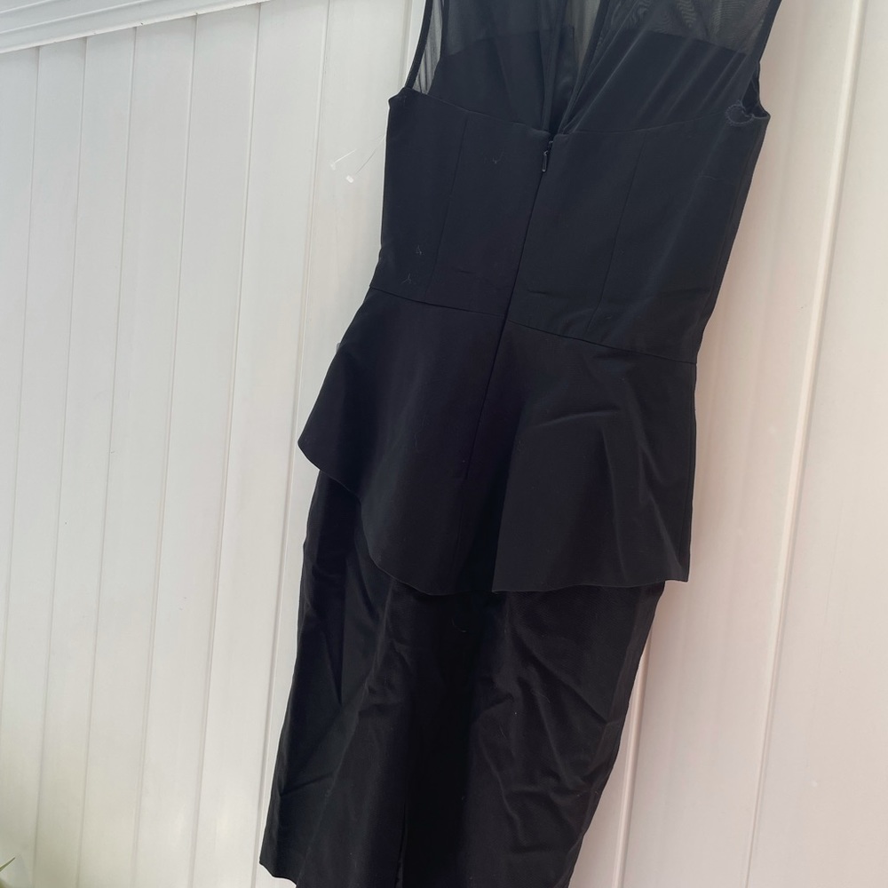New with tag peplum dress. Size 0 Above the knee
